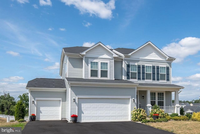 view of front of home with a porch and a garage