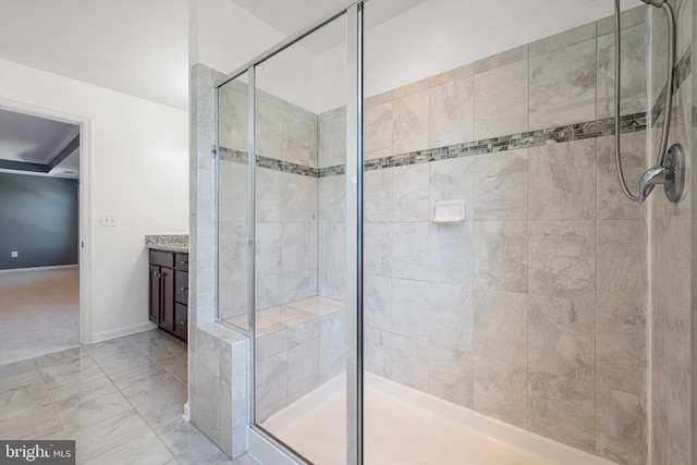 bathroom featuring vanity and a shower with shower door