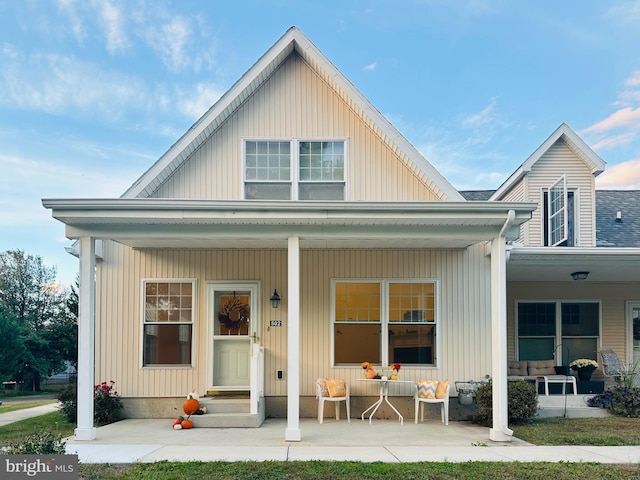 back of house with a porch