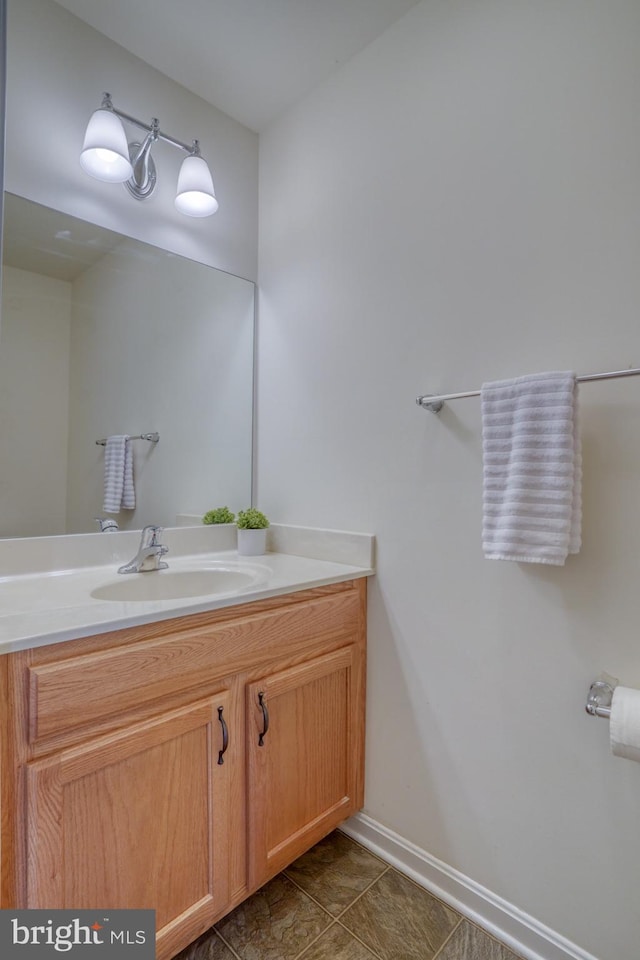 bathroom featuring tile patterned flooring and vanity