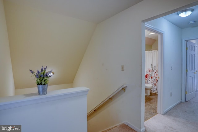 interior space with lofted ceiling and carpet