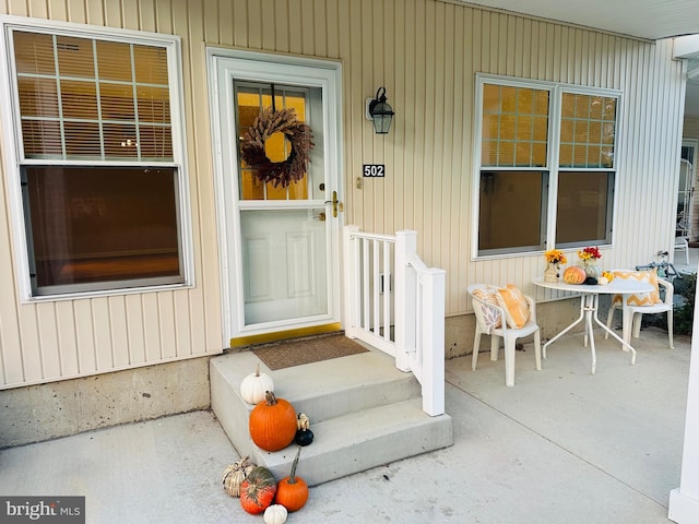 entrance to property with a patio