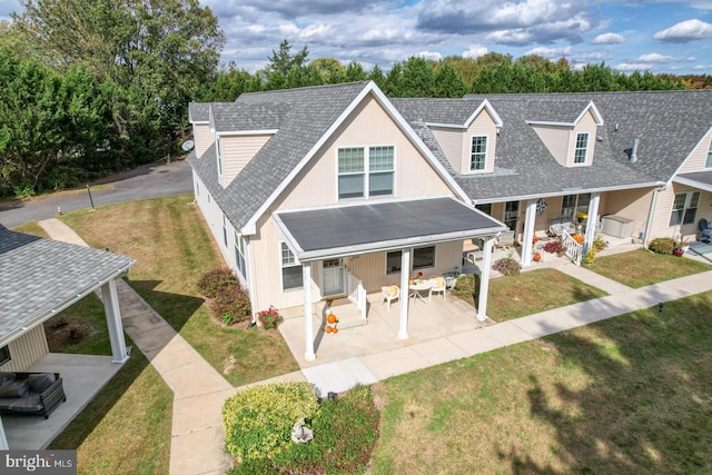 view of front of property with a front lawn and covered porch