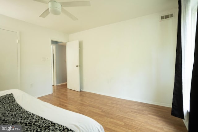 bedroom featuring ceiling fan and light hardwood / wood-style floors