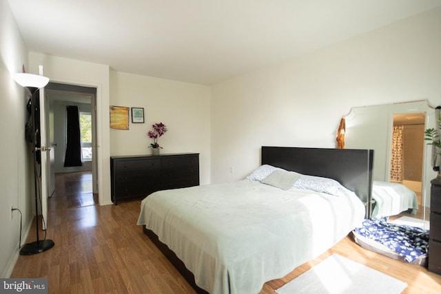 bedroom featuring dark hardwood / wood-style floors