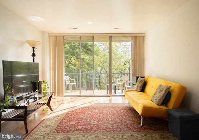 interior space featuring hardwood / wood-style flooring and floor to ceiling windows