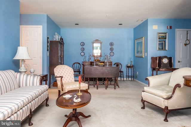 living room featuring light carpet