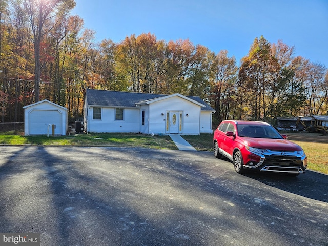 view of front of house with a storage shed