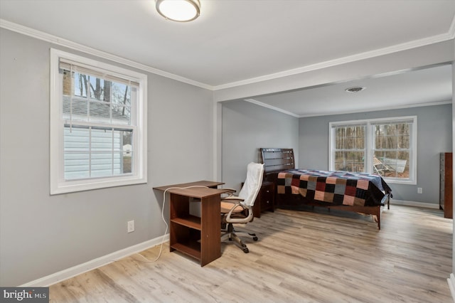 office space featuring ornamental molding and light hardwood / wood-style flooring