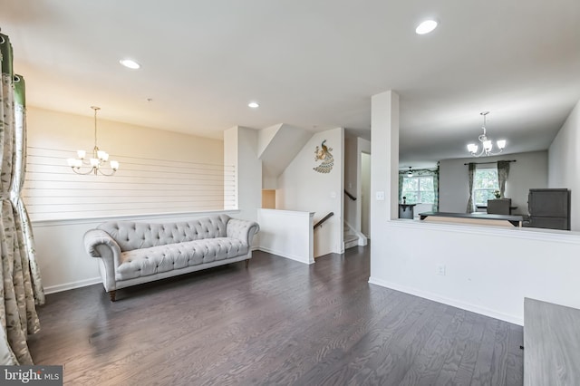 living room featuring dark hardwood / wood-style floors and a chandelier