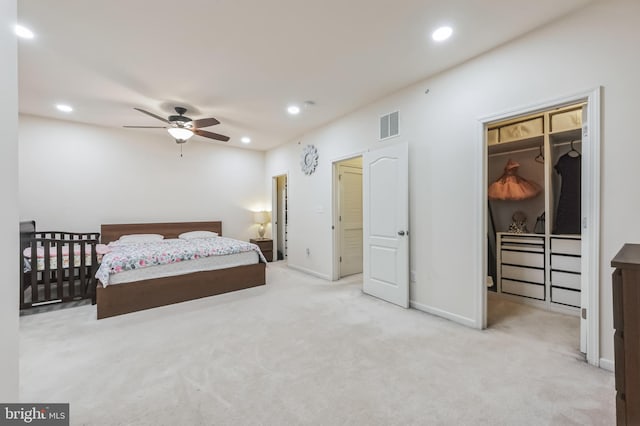 carpeted bedroom featuring ceiling fan