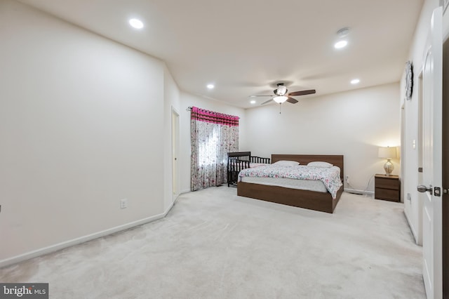 bedroom featuring ceiling fan and light carpet