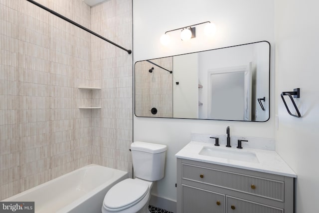 full bathroom with toilet, tiled shower / bath combo, and vanity