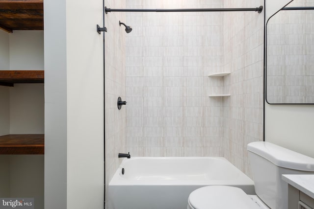 full bathroom featuring vanity, toilet, and tiled shower / bath