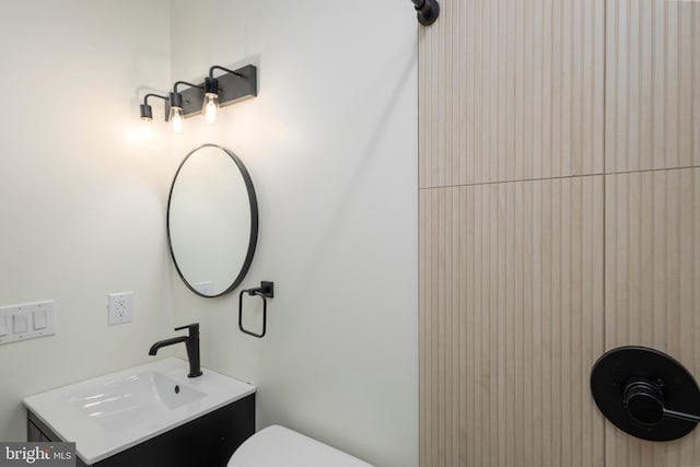 bathroom with toilet and vanity