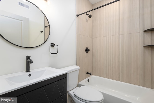 full bathroom featuring vanity, tiled shower / bath combo, and toilet