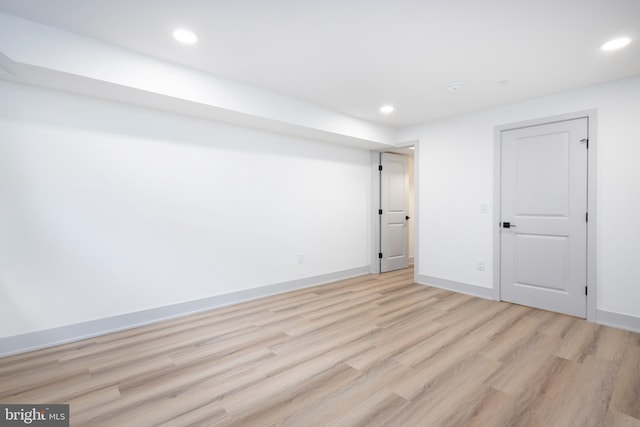 basement featuring light hardwood / wood-style floors