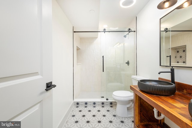 bathroom with vanity, toilet, and walk in shower