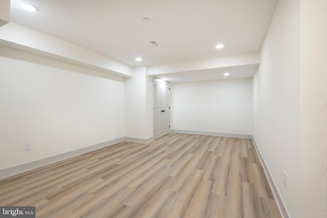 basement featuring light wood-type flooring