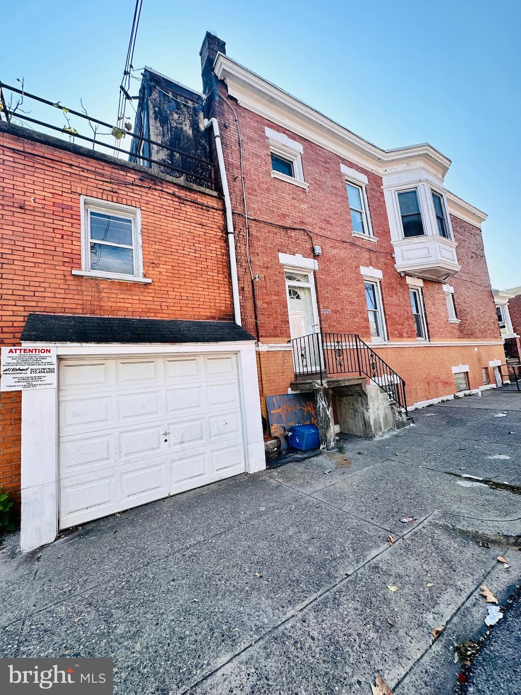 rear view of house with a garage