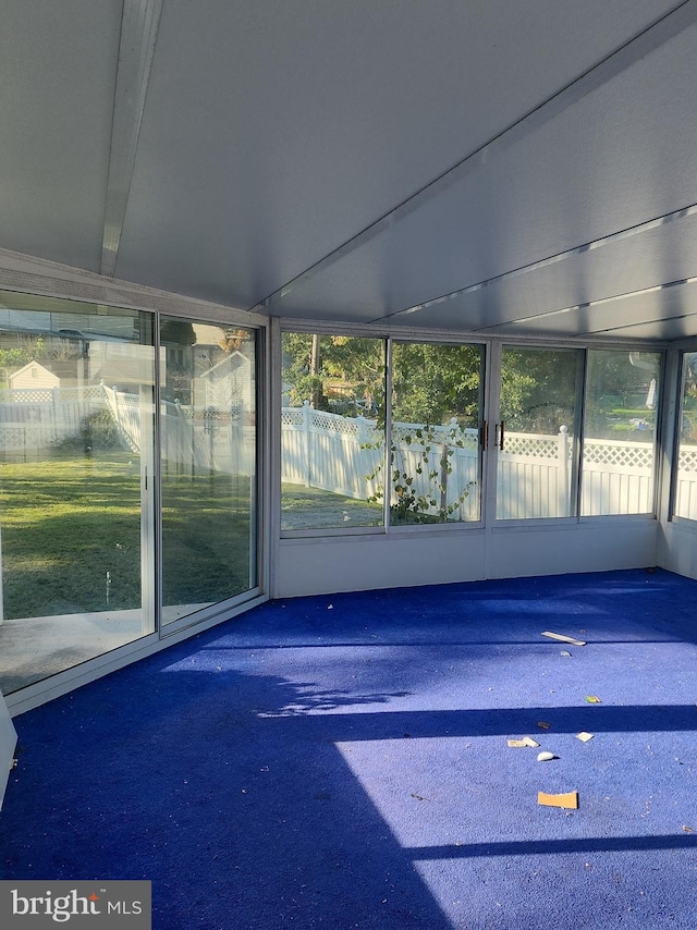 unfurnished sunroom featuring a healthy amount of sunlight