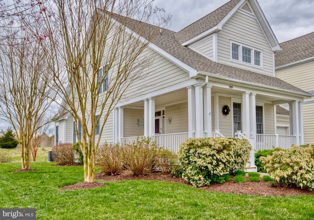 view of front of house featuring a porch and a front yard