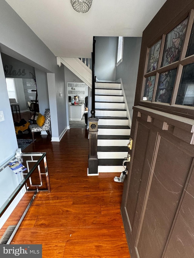 entrance foyer featuring dark wood-type flooring