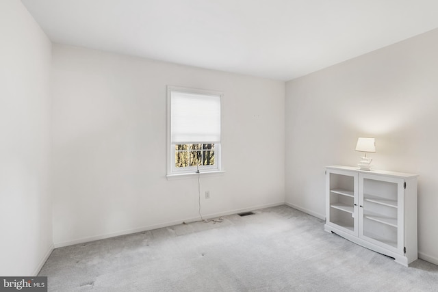 empty room with light colored carpet