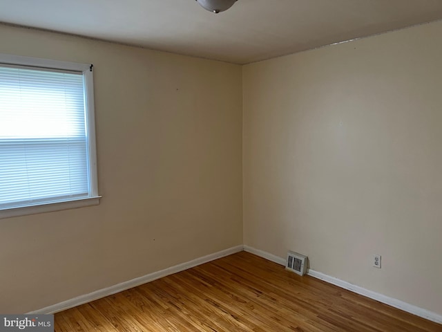 spare room with light wood-type flooring