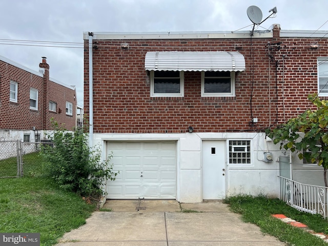 back of house with a garage