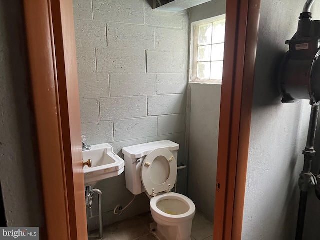 bathroom with tile patterned floors, toilet, and sink