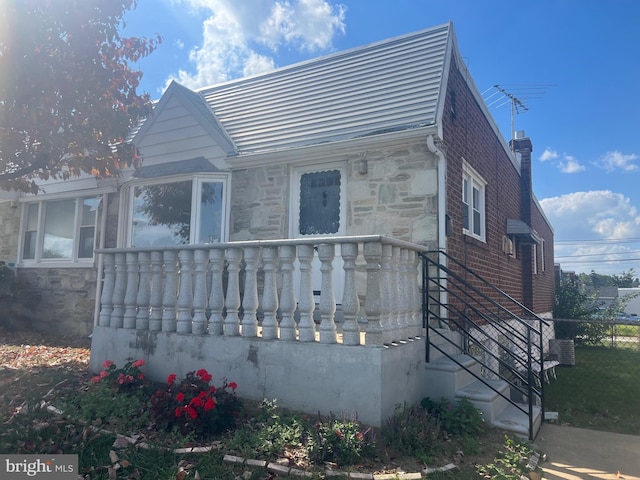 view of front of house with central air condition unit