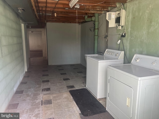 clothes washing area with washer and dryer