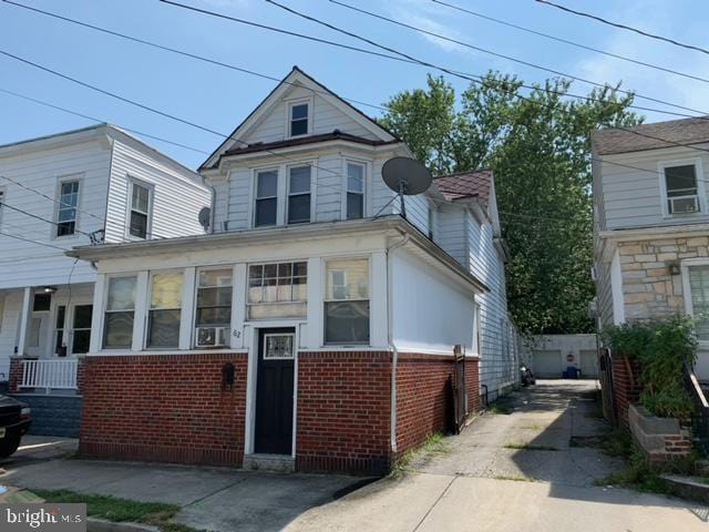 view of front of home with a sunroom