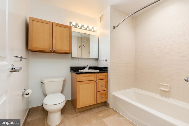 full bathroom with vanity, toilet, and tiled shower / bath