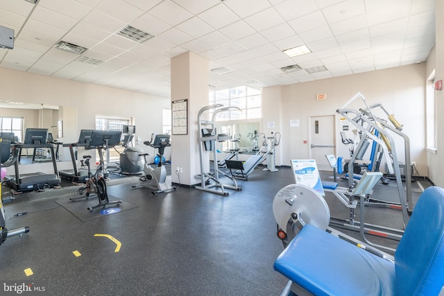 exercise room with a paneled ceiling