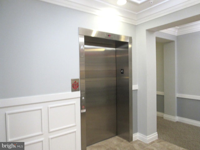 bathroom with elevator and ornamental molding