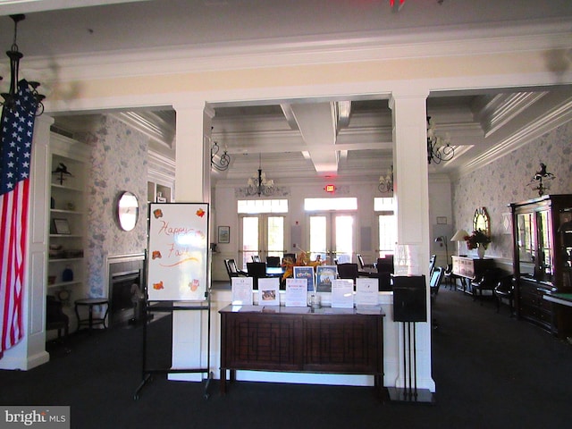 kitchen with coffered ceiling, an inviting chandelier, french doors, ornamental molding, and a fireplace