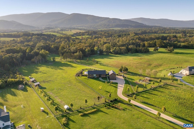 drone / aerial view with a mountain view and a rural view