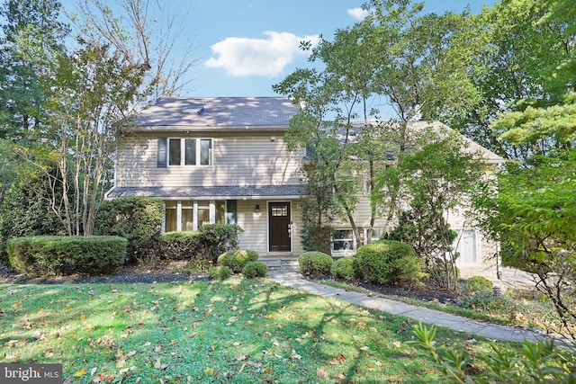 view of front of home with a front yard