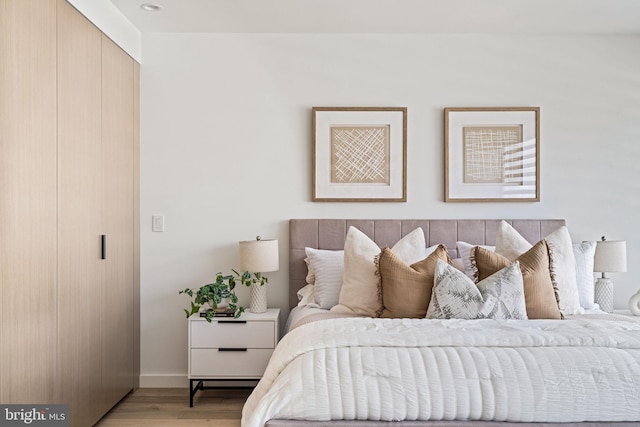 bedroom with light wood-type flooring