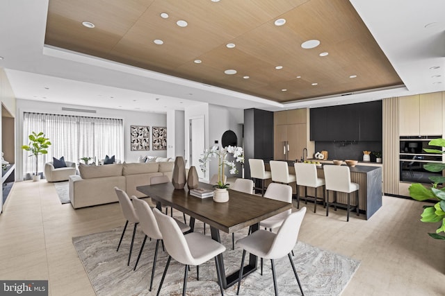 dining room with wooden ceiling and a tray ceiling