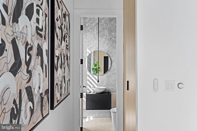 bathroom with vanity, toilet, and tile patterned flooring