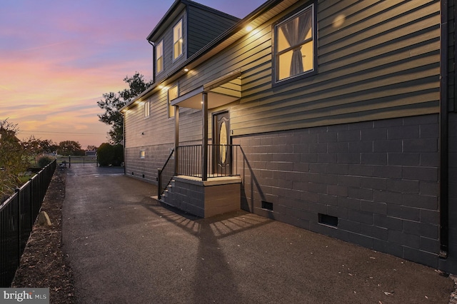 view of property exterior at dusk