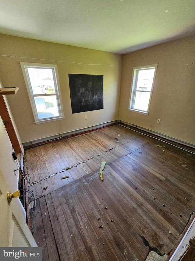 spare room featuring dark hardwood / wood-style flooring