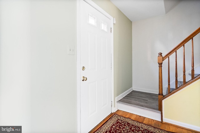 foyer entrance with hardwood / wood-style flooring