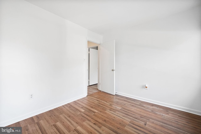 empty room featuring hardwood / wood-style flooring