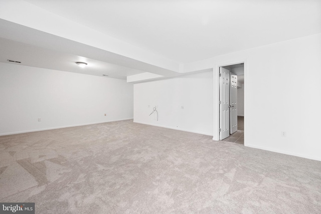 empty room with light colored carpet