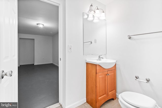 bathroom with vanity, toilet, and tile patterned flooring