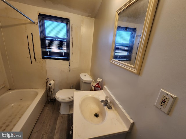 full bathroom with bathtub / shower combination, hardwood / wood-style flooring, vanity, and toilet